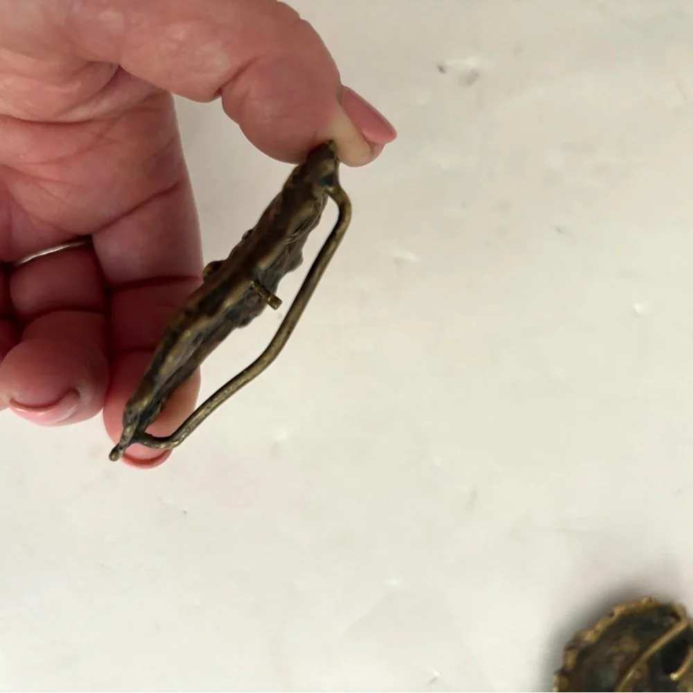 Three vintage belt buckles